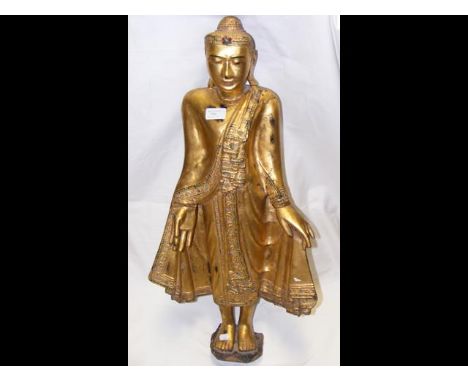 An antique wooden statue of standing Buddha - 78cm tall - with stand 
