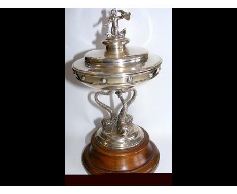 A decorative silver bowl and cover, on Dolphin supports, with Neptune mount to the lid by Mappin & Webb - 25cm high including