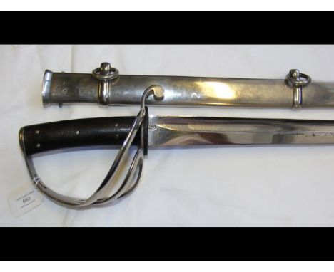 A British patent 1853 Cavalry sabre with metal scabbard - 106cm long - with later inscription to blade CONDITION REPORTpresen