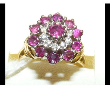 A ruby and diamond ring in 18ct gold setting 