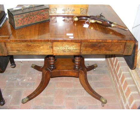 A 19th century rosewood sofa table with brass inlay and shaped support - 160cm x 67cm 