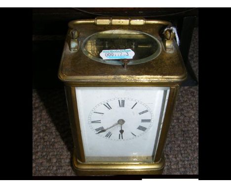 A 13cm brass cased repeater carriage clock with white enamel dial and Roman numerals CONDITION REPORTseems ok
