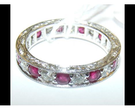 An 18ct gold ruby and diamond full eternity ring 