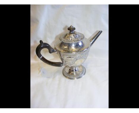 Decorative silver teapot with ebony handle and repousse decoration - 21oz 