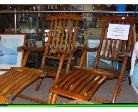 A pair of vintage folding steamer chairs with carved star to the backrest CONDITION REPORTseem ok