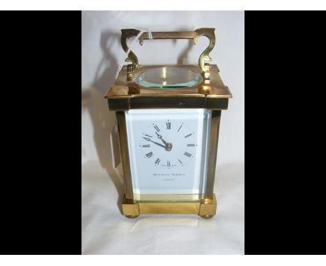 A Matthew Norman brass cased carriage clock - 13cm high - with Certificate and key 