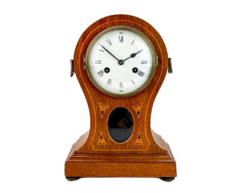 An Edwardian mahogany and inlaid balloon-shaped mantel clock. The German movement striking on a coiled gong, height 34cm.