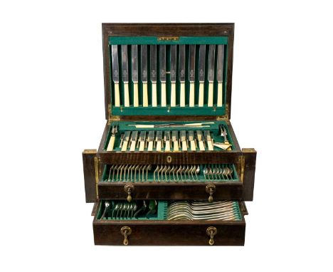 An oak cased canteen of OE pattern cutlery 12 place settings ( a few deficient), in a two drawer cabinet with a rising top.