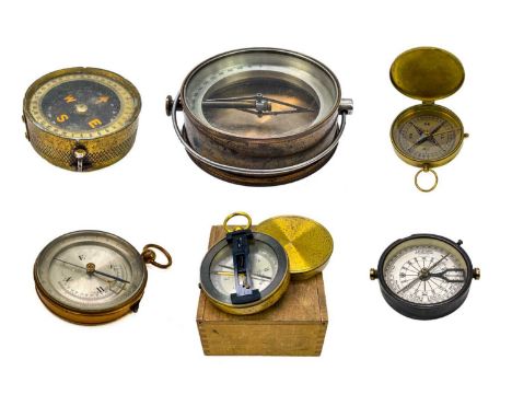 A brass dip needle compass. Diameter 9.5cm together with five various compasses. (6)