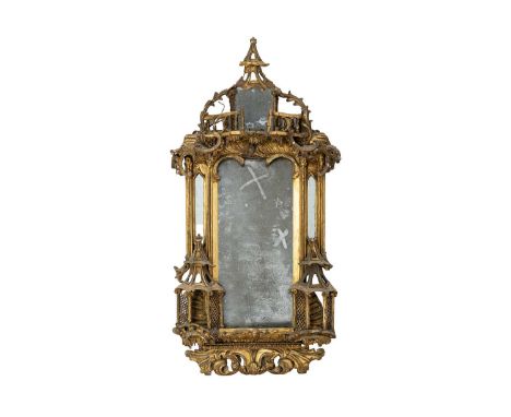 A George III gilt gesso and carved wood wall mirror. In the Chinese Chippendale taste, the galleried pagoda top with scrolls,