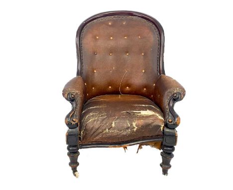 A Victorian mahogany button back armchair. With leatherette upholstery, scroll end arms and turned front legs, height 97.5cm,