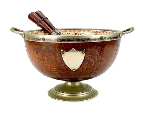 A late Victorian oak and silver plated salad bowl. With twin handles and removable sepia printed pottery liner and two server