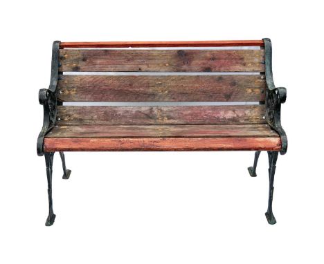 A cast metal and slatted wood two seat garden bench.  Height 71cm, width 105cm, depth 55cm.