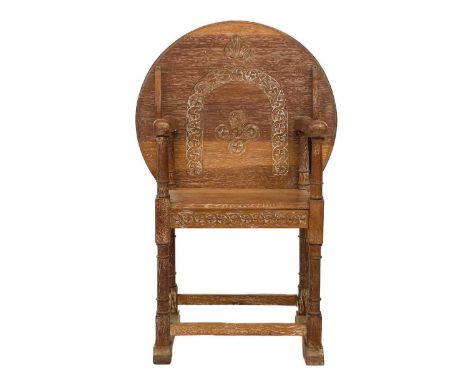 A 20th century limed oak monk's bench. With carved circular hinged top, height 105cm.