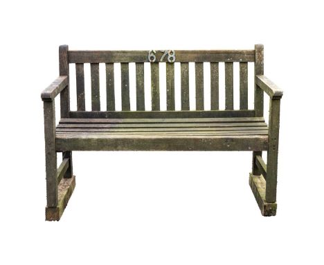 A wooden garden bench.  Height 89cm, width 122cm, depth 58cm.A little bit of movement to the arms and back but generally in a