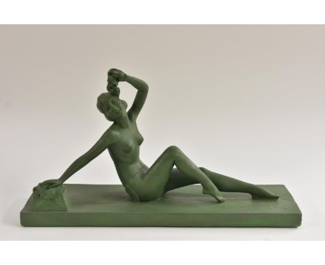 After Melani, a French Art Deco style, painted plaster model of a reclining nude, scantiliy draped, holding a garland, 55cm w