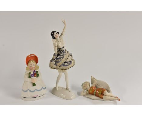 An Art Deco Goebel novelty flask modelled as a young girl in bright orange poke bonnet holding a colourful bouquet of flowers