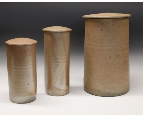 Joanna Constantinidis (1927-2000) - a  large cylindrical jar and cover, manganese speckled on a textured  buff ground, 34.5cm
