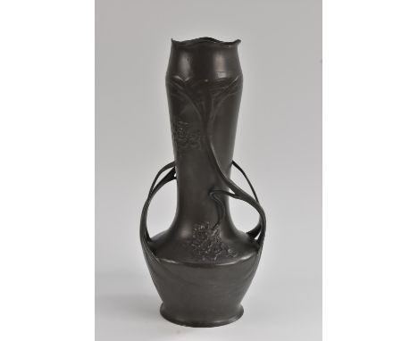 A late 19th/ early 20th century Art Nouveau pewter twin handled vase, shaped bulbous body with floral panel decoration, sinuo