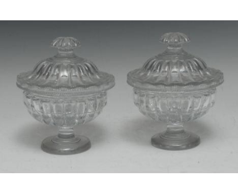 A pair of 19th century Le Creusot  clear glass lobed pedestal sweetmeat jars and covers, fluted button finials, 18cm high