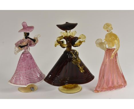 A Venetian Murano glass figure of an elegantly dressed lady, in pink wide brimmed hat and frilled skirts, 32cm, paper label; 