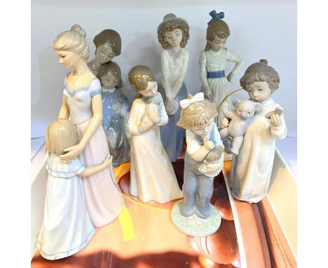 NAO figures: 6 children and a mother and child at bedtime, another figure 