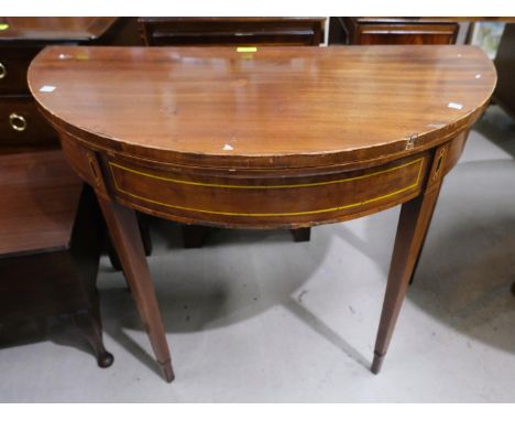 A late 19th/early 20th century mahogany demi-lune fold over inlaid card table 