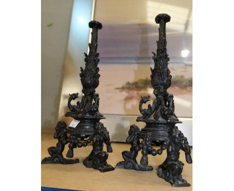 A PAIR of BRONZE CANDLESTICK BASES, 19th century french in the manner of CELLINI, triform design with putto supports, 28cmapp