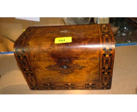 A burr walnut and Tunbridge ware tea caddy with mother of pearl in sets.Showing some wear, escutcheon missing, inlays complet
