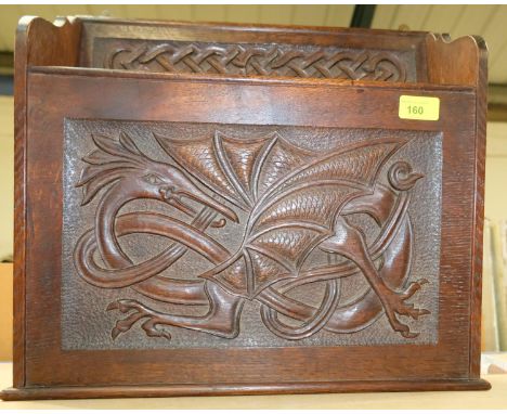 A Welsh carved oak wall hanging large candle/ tappering holder with carved dragon and Celtic knot type carving 