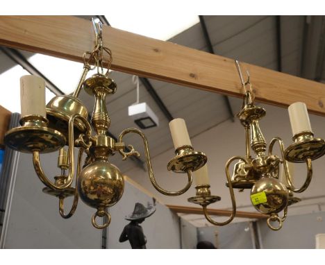 A pair of 3 branch brass pendant light fittings 