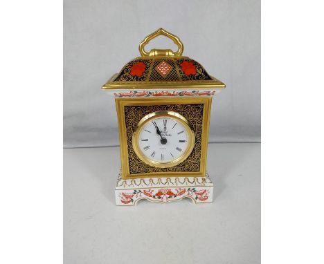 A Royal Crown Derby mantle clock, height 19 cm.In good condition 