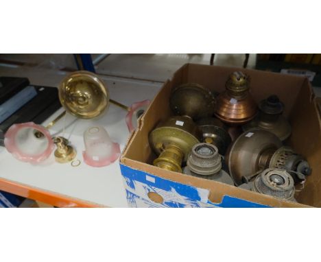 A Victorian style rise and fall converted oil lamp and a large selection of glass light shades; a collection of oil lamp base