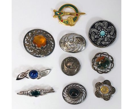 10 brooches of Celtic design including Edinburgh hallmarked silver circular brooch with Viking ship, a moss agate brooch stam