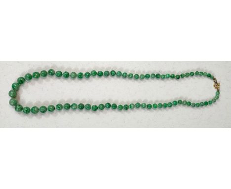 GREEN JADE BEADS, a string of graduated beads, c. 1920, 50cm 