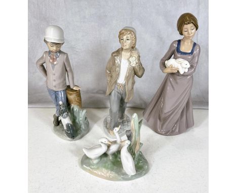 Four Nao groups of figures boy with dog, sailor boy girl with rabbit and a group of ducks 