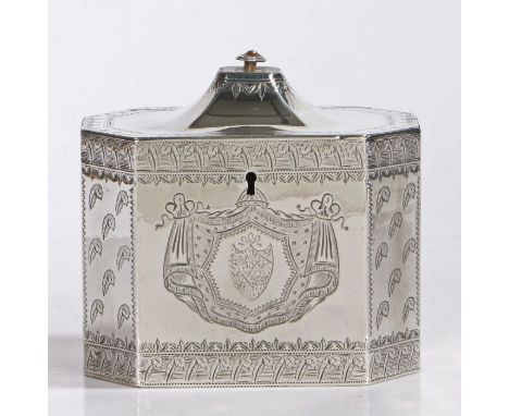 A George III silver tea caddy, London 1789, maker Henry Chawner, of octagonal form, the domed hinged lid above a central armo