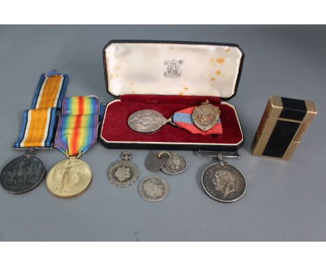 A World War One 1914-18 Medal and a Victory Medal awarded to 5670 Cpl A. Saban Herts Regiment with ribbons, a World War One 1