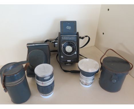 A Kalimar Six Sixty SLR 6cm x 6cm exposure camera with two additional lenses circa 1960's made by Fujita