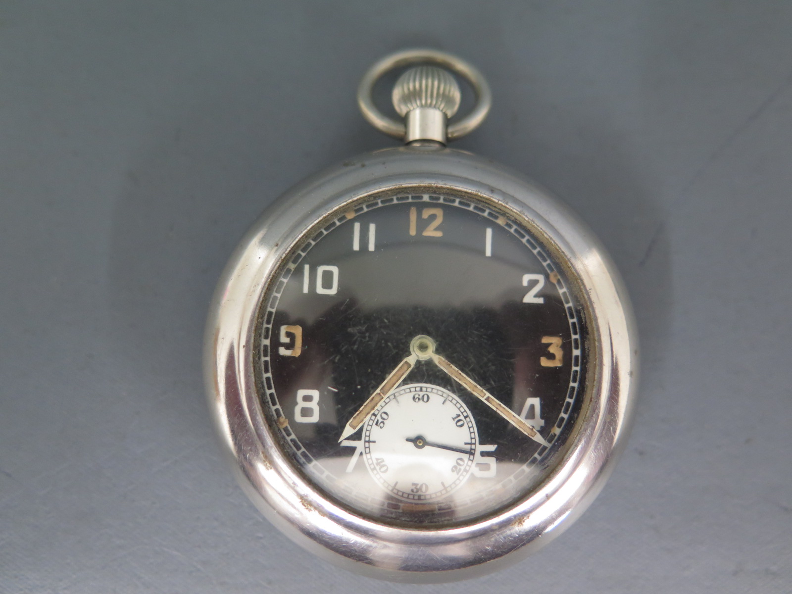 A WW2 Bravingtons, Swiss made, military pocket watch in metal case with