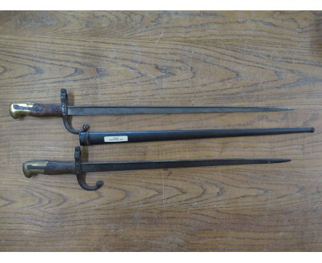 A French 1874 model Gras Rifle Bayonet  overall length 66cm with scabbard and an 1874 model Gras Rifle Bayonet without scabba