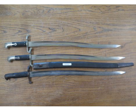 Two United Kingdom pattern 1858 and one 1856 Sabre Bayonets, two of blades stamped with V.R, Cipher - overall length of Bayon