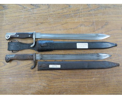 A German Imperial S98/05 n. A.S. Sawback Butchers Blade Mauser 7.95 Modell 1898 Bayonet in scabbard with a German S98/05 n. A