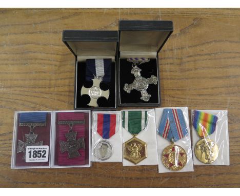 A collection of replica/copy medals including Victoria Cross - Army and Naval - DSC, DFC and Foreign including USA First Worl