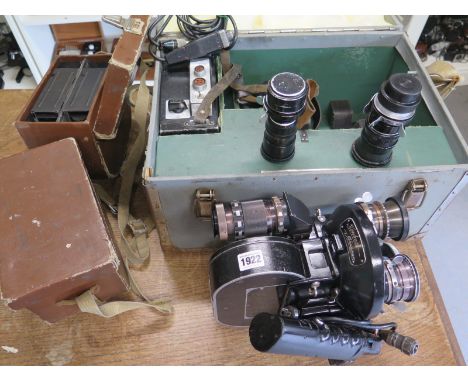 A Konvas Automat Russian circa 1960's Moskaner Kinowerke 35mm Movie Camera with 4 extra canisters and carry case and two extr
