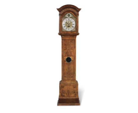 An early 18th Century walnut longcase clockJoseph Windmills, LondonThe case with overhanging cornice and carved fret over a m