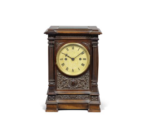 A fine early 20th century carved mahogany table clock, dated 1905Clifford Lupton, London, 1905 The inverted breakfront archit