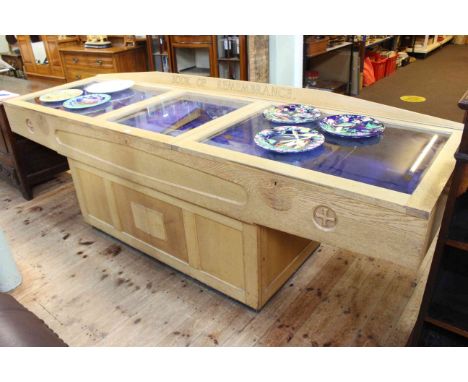 Light oak book of remembrance table cabinet, 88cm by 264cm by 79cm.