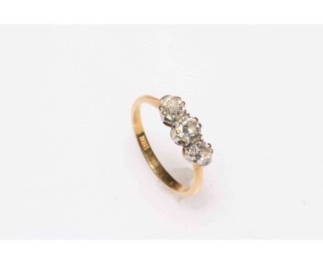 Three stone diamond and 18 carat gold ring, size O.