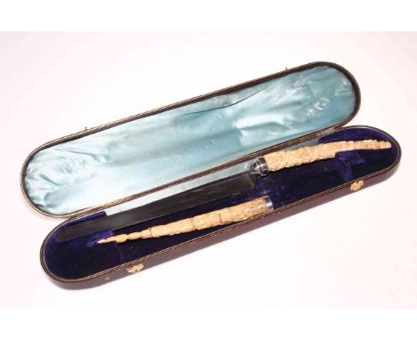 Victorian cased carving set with African carved tusk handles decorated with multi figures (lacking steel fork), 59cm case len